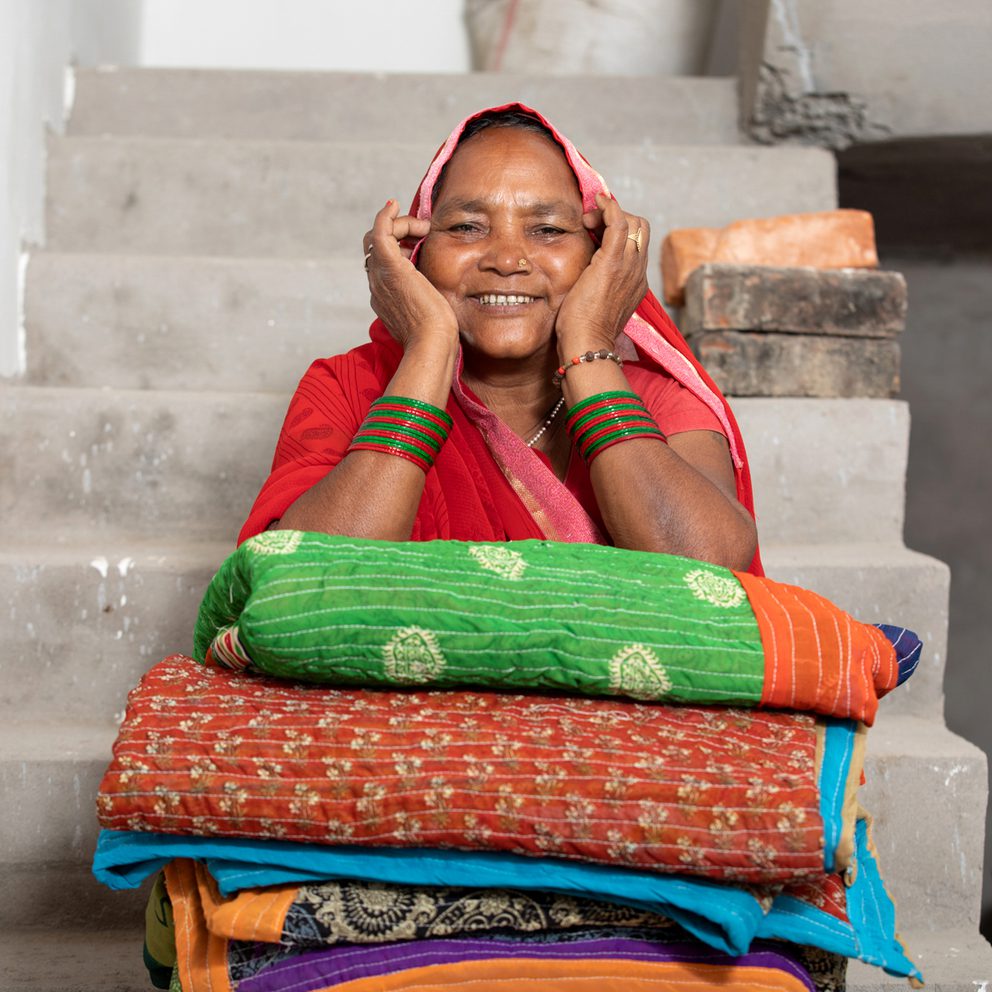 Happy smiling woman sat on steps