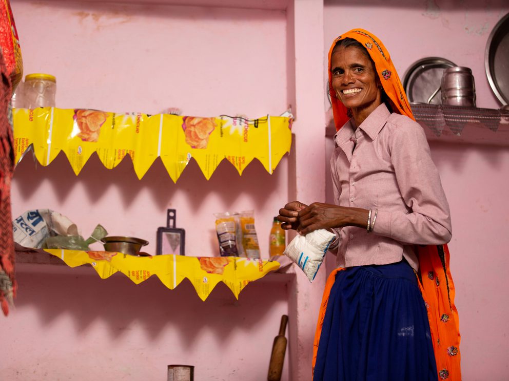 Smiling woman in orange dupatta